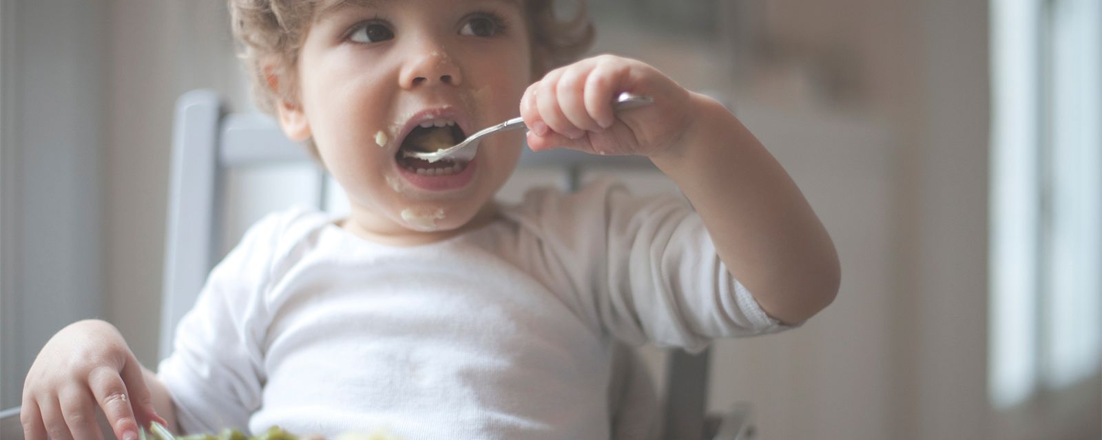 Toddler enjoying his meal