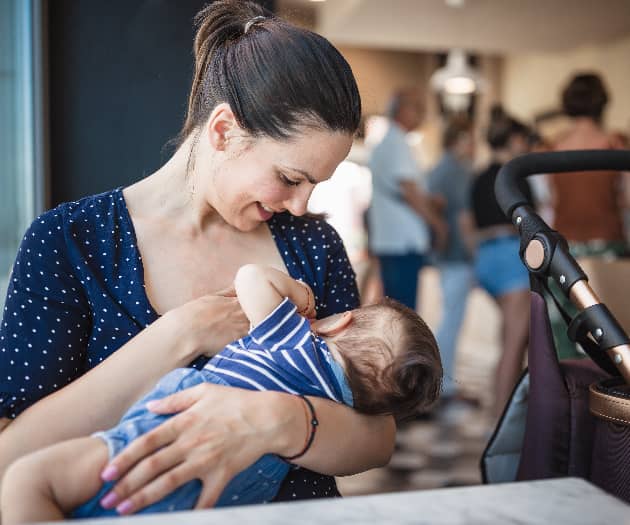 Mother breastfeeding in public